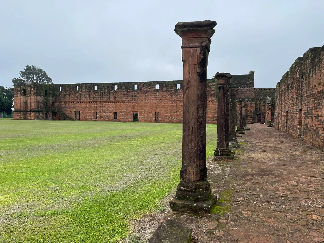 Weathered stone ruins of a 17th-century Jesuit mission in Paraguay, part of a UNESCO World Heritage Site
